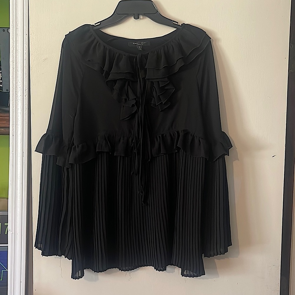 Dressy top. Pleated and detailed. Tie front.